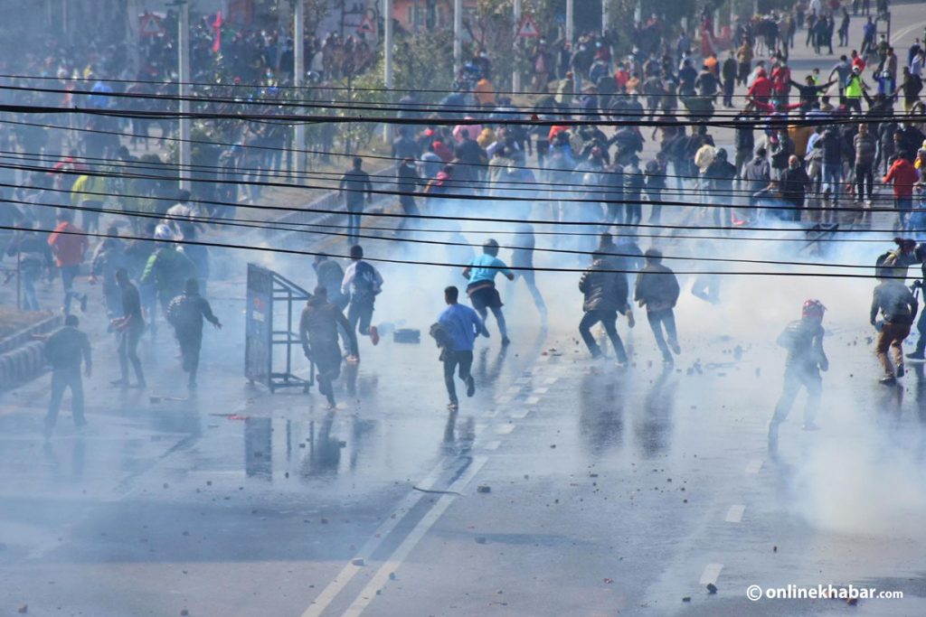 Police try to control protesters by lobbing tear gas shells during an anti-MCC protest, in Kathmandu, on Wednesday, February 16, 2022. Photo: Chandra Bahadur Ale