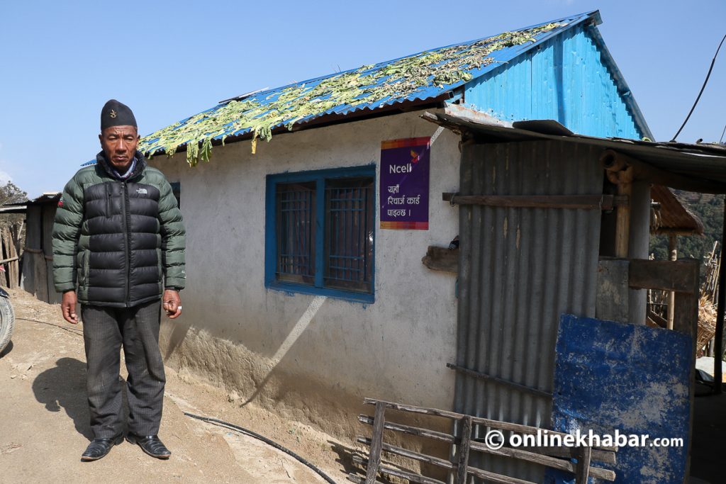 Ratna Bahadur Tamang in front of his home as he comes back after 22 years of disappearance. Photo: Aryan Dhimal