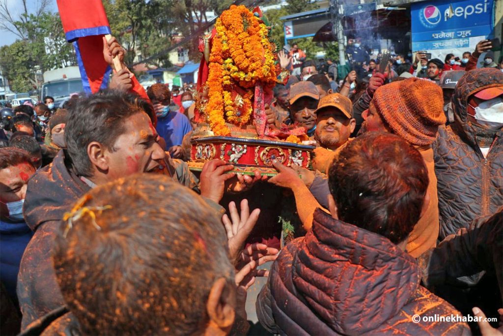 Locals celebrate as a stolen statue is recovered in Lalitpur, on Friday, February 11, 2022. Photo: Aryan Dhimal