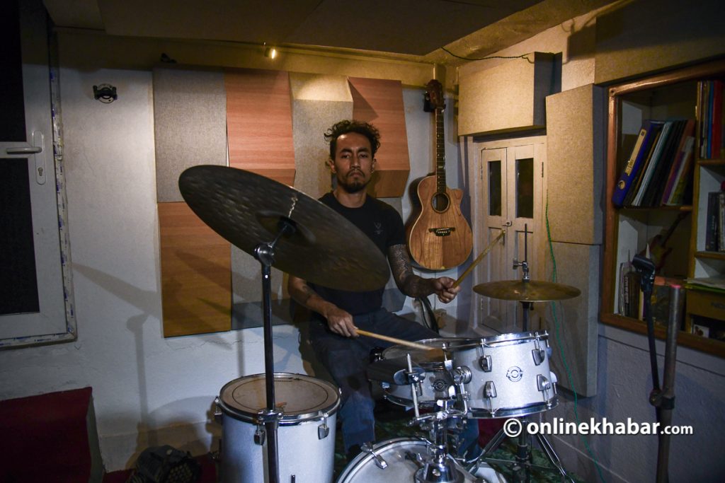 Jay Ram Karki playing in his studio. Photo: Chandra Bahadur Ale