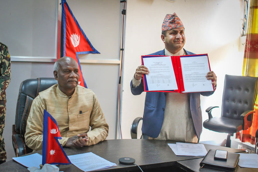 L-R: Agriculture Minister Mahindra Raya Yadav and Secretary Govinda Prasad Sharma show the agreement signed with India for the import of chemical fertiliser, in Kathmandu, on Monday, February 28, 2022.