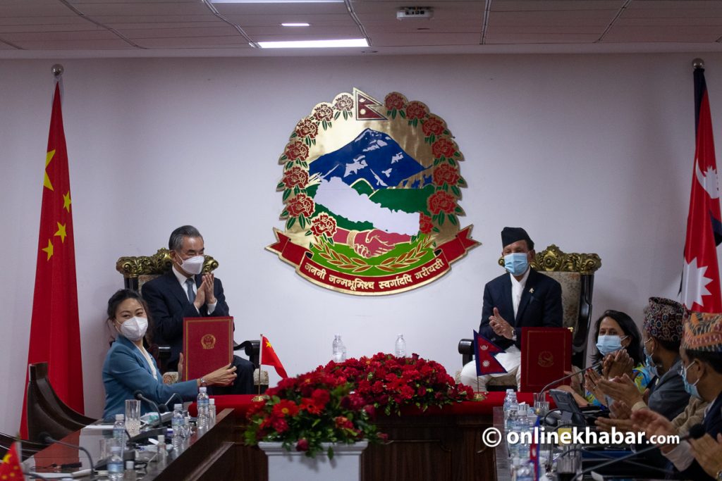 Chinese Foreign Affairs Minister Wang Yi with his Nepali counterpart Narayan Khadka witness signing and exchange of various bilateral agreements, in Kathmandu, on Saturday, March 26, 2022. Photo: Aryan Dhimal