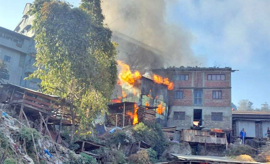 A house catches fire in Phungling of the Taplejung district, on Friday, March 11, 2022.
