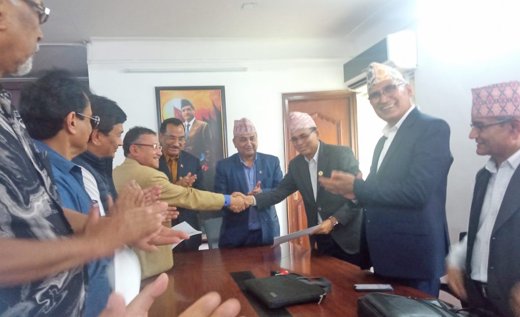 CPN-UML and RPP sign an agreement for a partnership for the May 13 local elections, in Kathmandu, on Wednesday, April 13, 2022.