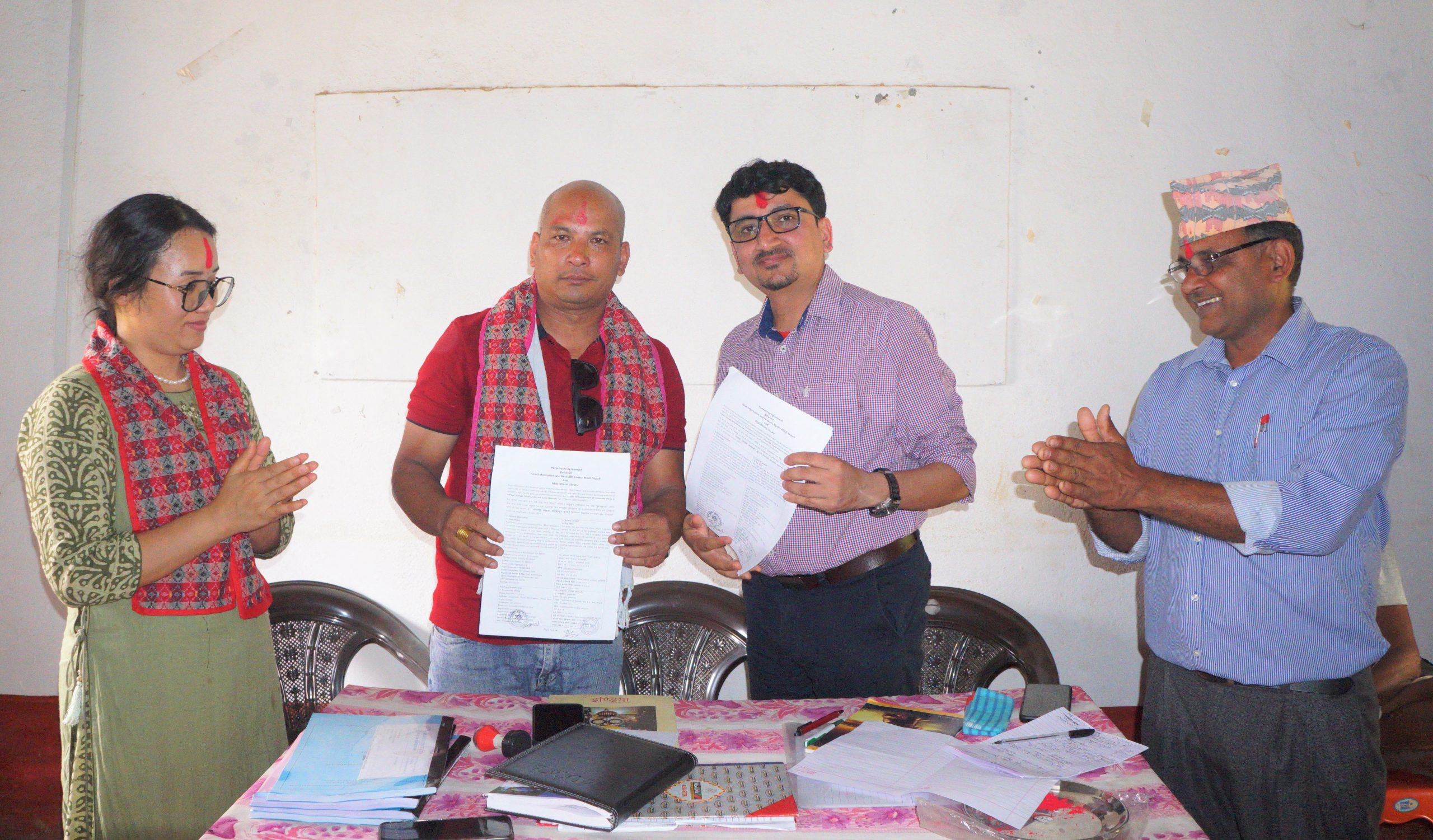 Syangja's Matribhumi Library and Read Nepal sign an agreement for Read Nepal's support to the library, in Kaligandaki, Syangja, on Friday, April 22, 2022. Photo: Courtesy Rajendra Prasad Pandey