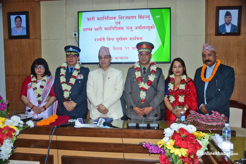 Home Secretary Tek Narayan Pandey is flanked by newly appointed chiefs of Nepal Police and Armed Police Force, Dhiraj Pratap Singh (2nd from left) and Raju Aryal (third from right) and their spouses, in Kathmandu, on Monday, May 2, 2022. Photo: Chandra Bahadur Ale