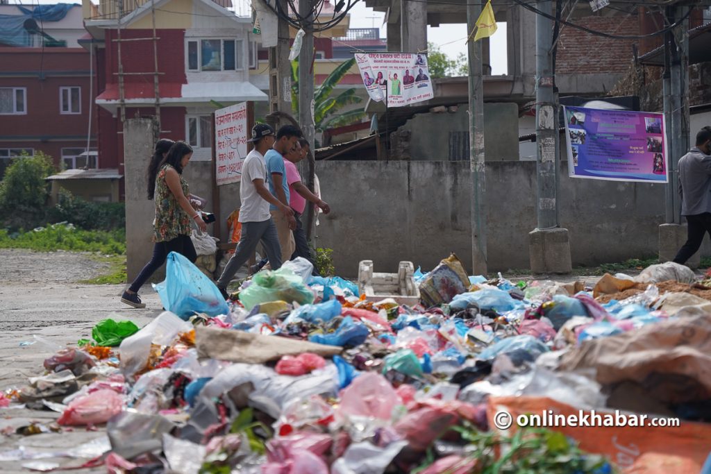 Waste piles up on a Kathmandu road, in Kathmandu, in May 2022.