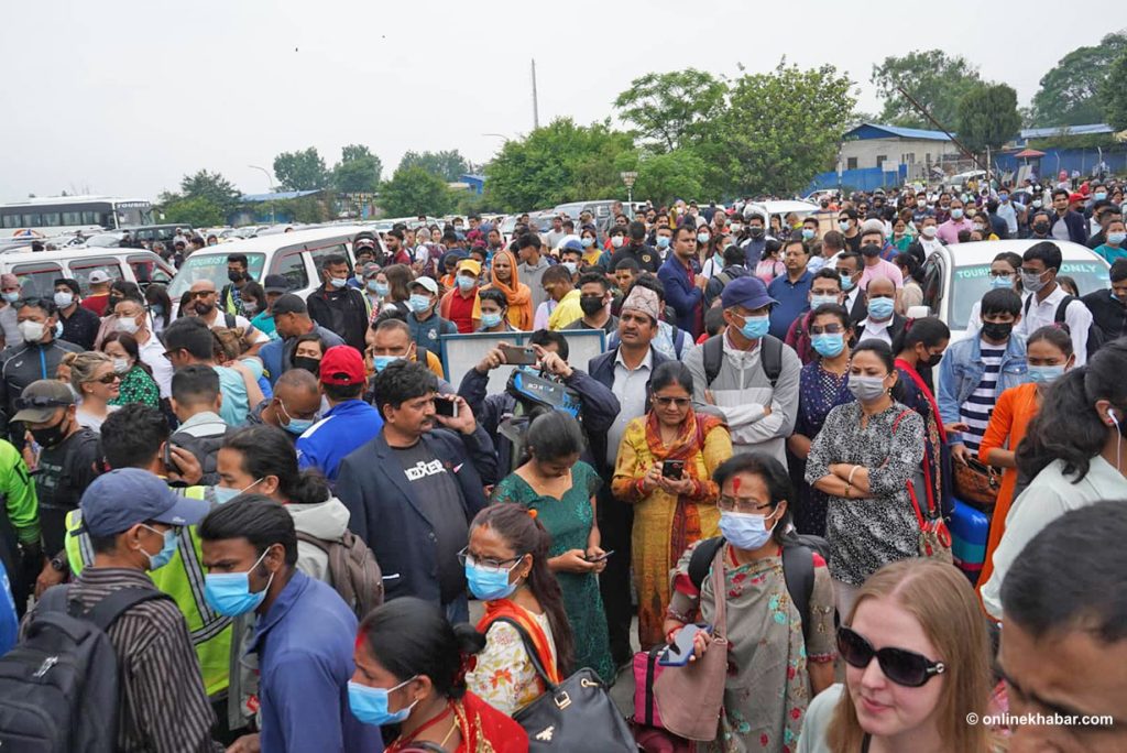 Passengers evacuated after a hoax bomb call at the domestic terminal of Kathmandu airport, on Wednesday, May 4, 2022. Photo: Shankar Giri