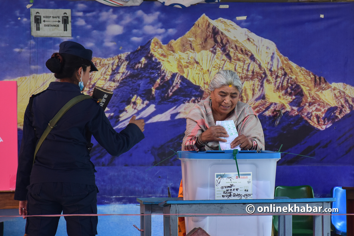 A woman casts her vote in the local elections in Kathmandu, on Friday, May 13, 2022.