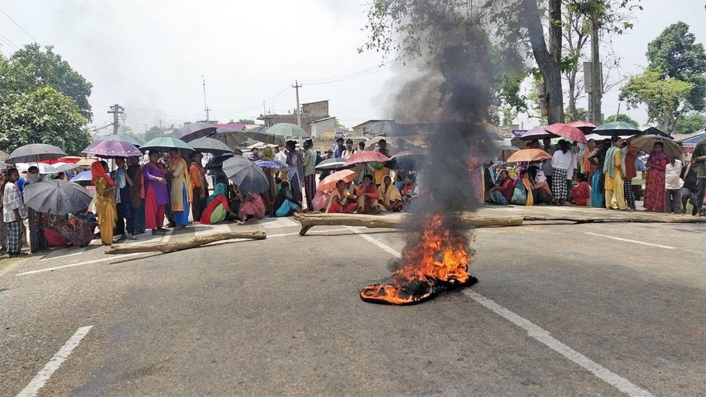 Bardiya locals block the road demanding security from wildlife, in the district's Madhuwan, in June 2022.