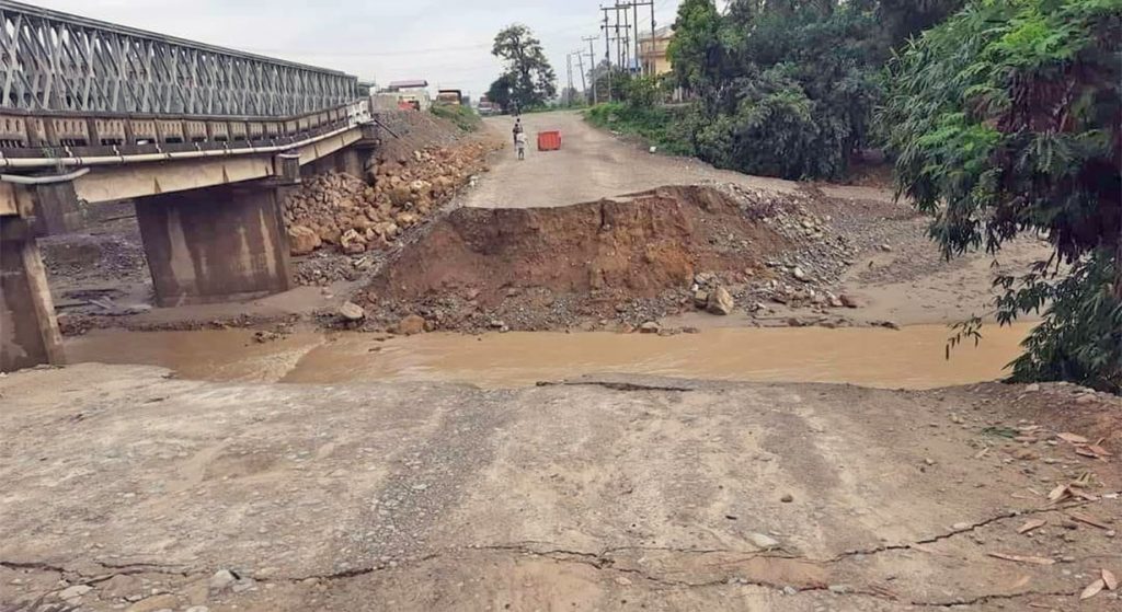 A diversion is washed away by the flooded Turiya stream, in Nawalparasi, obstructing the vehicular movement along the East-West Highway, on Thursday, June 16, 2022.