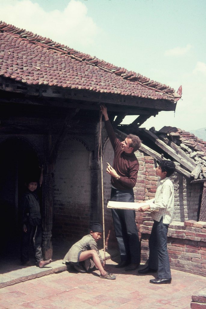 Wolfgang Korn measuring a Newa house in the 1970s. Photo Courtesy: Wolfgang Korn