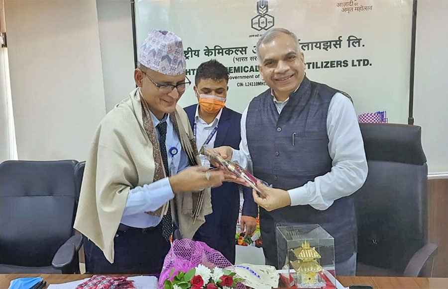 Officials of Nepal's Krishi Samagri Company Limited and India's Rashtriya Chemicals and Fertilisers Limited sign an agreement to ensure chemical fertiliser import in Nepal from India, in July 2022.