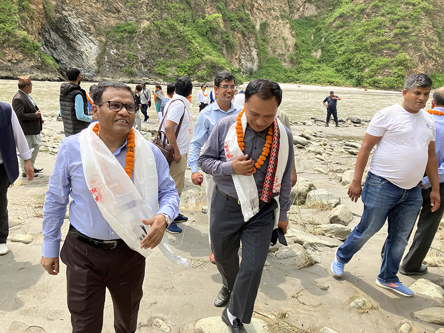 Nepali and Bangladeshi energy and electricity officials in the Sunkoshi III Hydropower Project site in August 2022