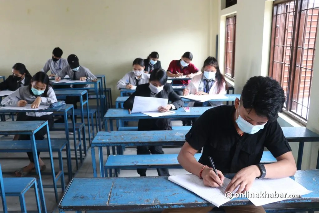 File: Students take an examination