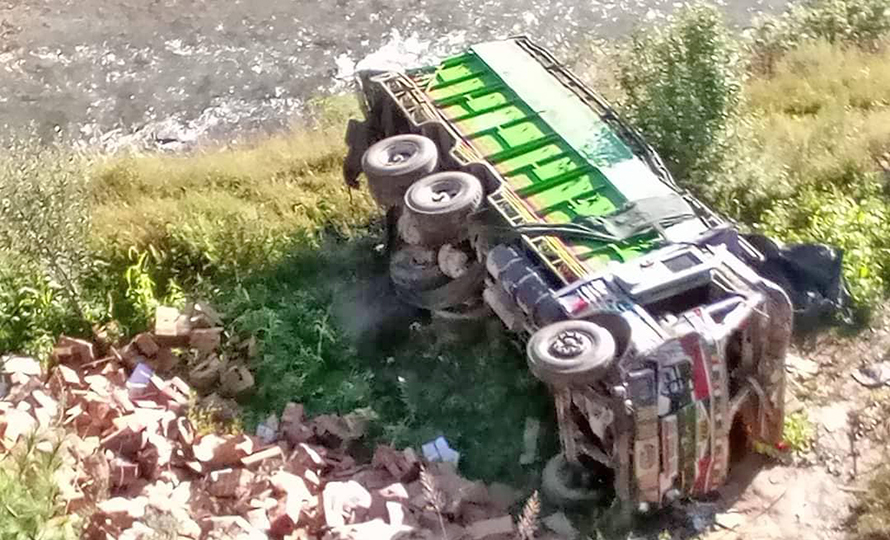 A truck falls off the road in Hima rural municipality of Humla, on Wednesday, September 28, 2022. 