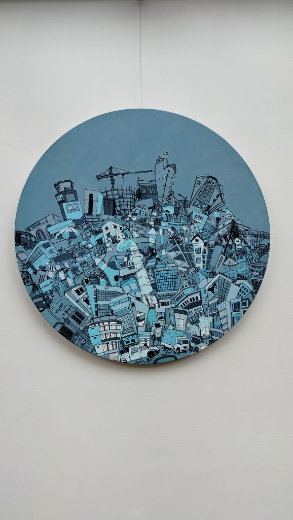 The canvas is covered with urban chaos and the colour blue dominates the painting.