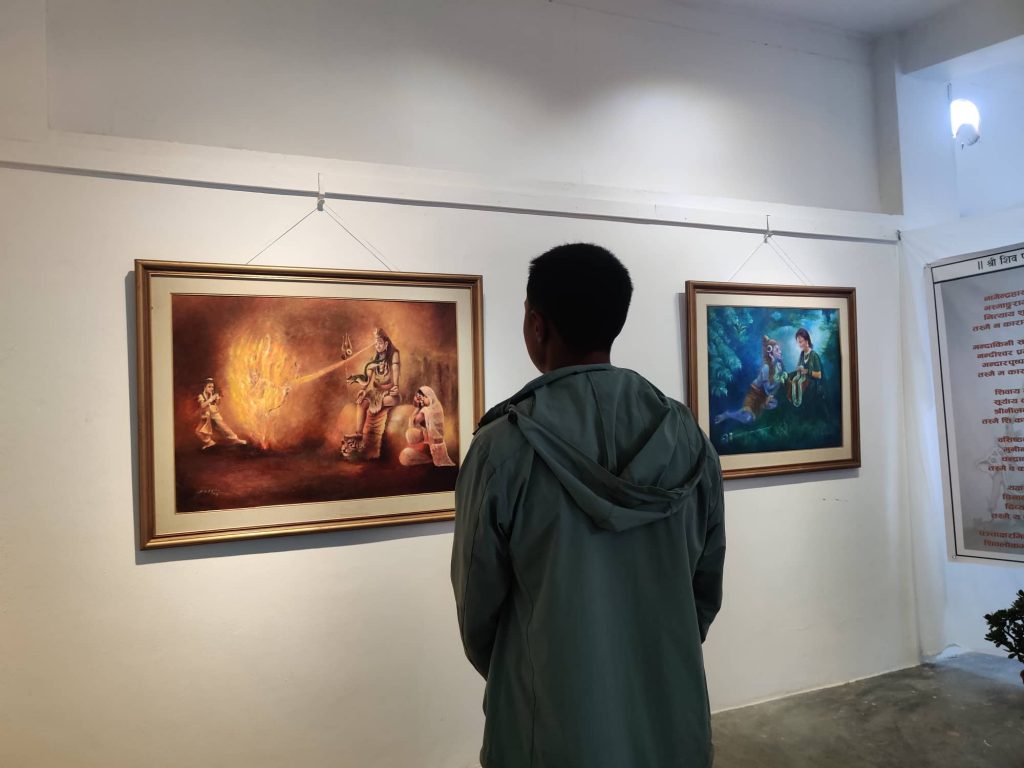 A viewer at Suresh Kumar Dyola's exhibition Satyam Shivam Sundaram. Photo: Nasana Bajracharya