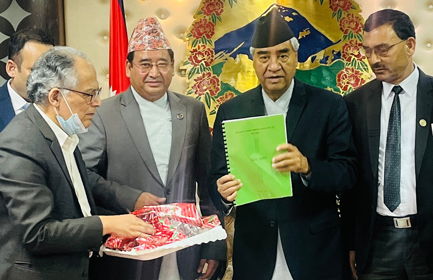 Prime Minister Sher Bahadur Deuba receives a report about the Nijgadh airport plan, in Kathmandu, on Sunday, September 18, 2022. 