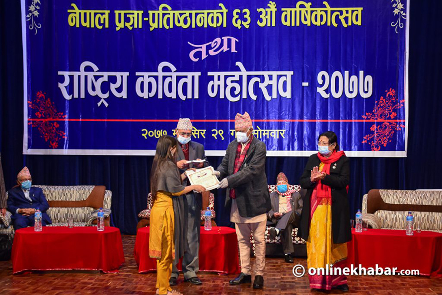 File: Prizes are being distributed to winners of a poetry competition hosted by the Nepal Academy.