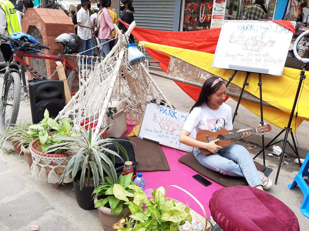A campaigner poses for a photo during the Park(ing) Day celebration in Kathmandu, demanding more open space in the city, in September 2022. Photo: Courtesy Niharika Mathema