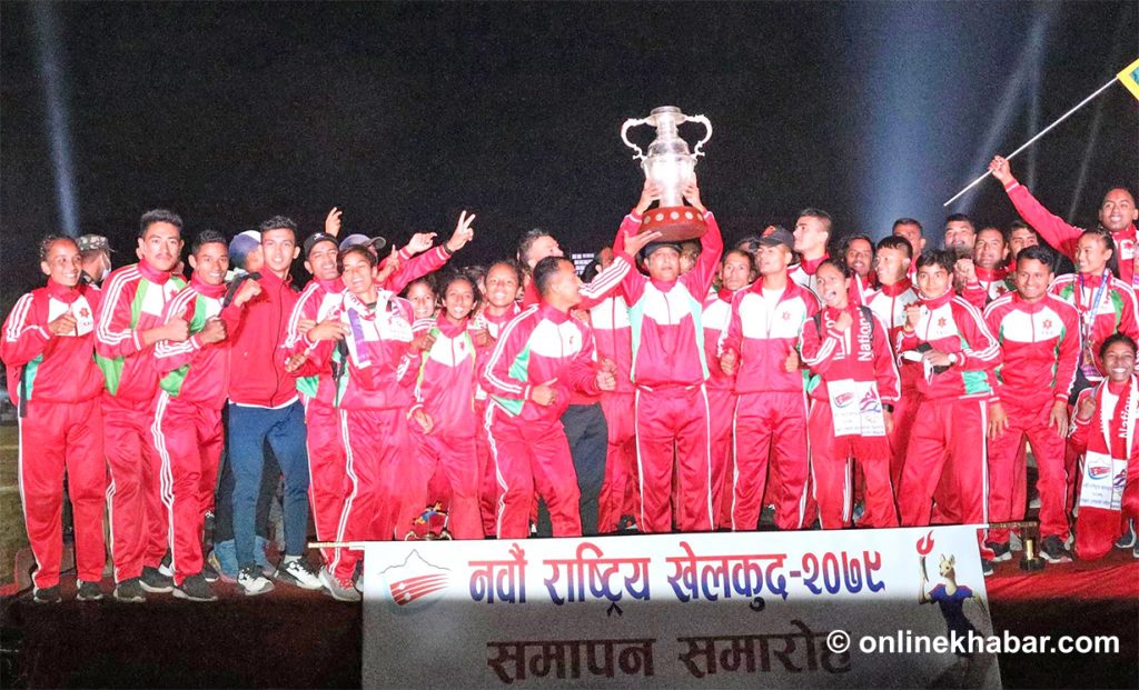 The Tribhuvan Army Club players lift the trophy of the ninth National Games in Pokhara, on Thursday, October 20, 2022. Photo: Sudarshan Ranjit