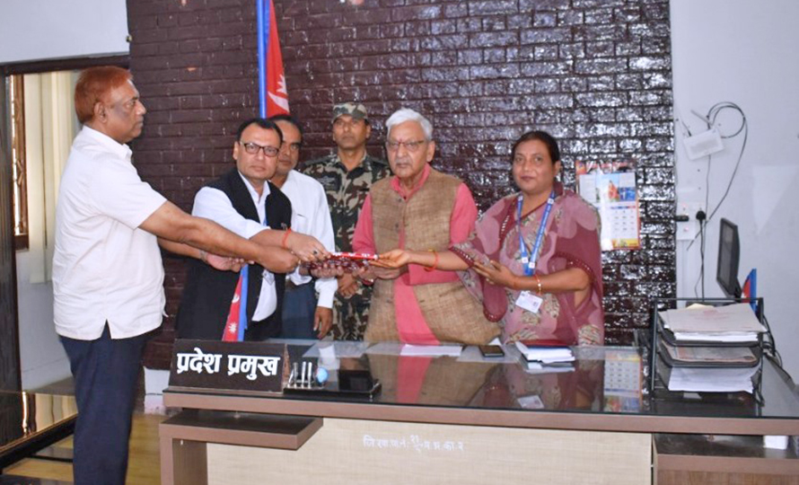 Janalokpal Aayog officials submit its annual report to Madhesh Province Chief (Governor) Hari Shankar Mishra, in Janakpurdham, on Sunday, October 16, 2022. 