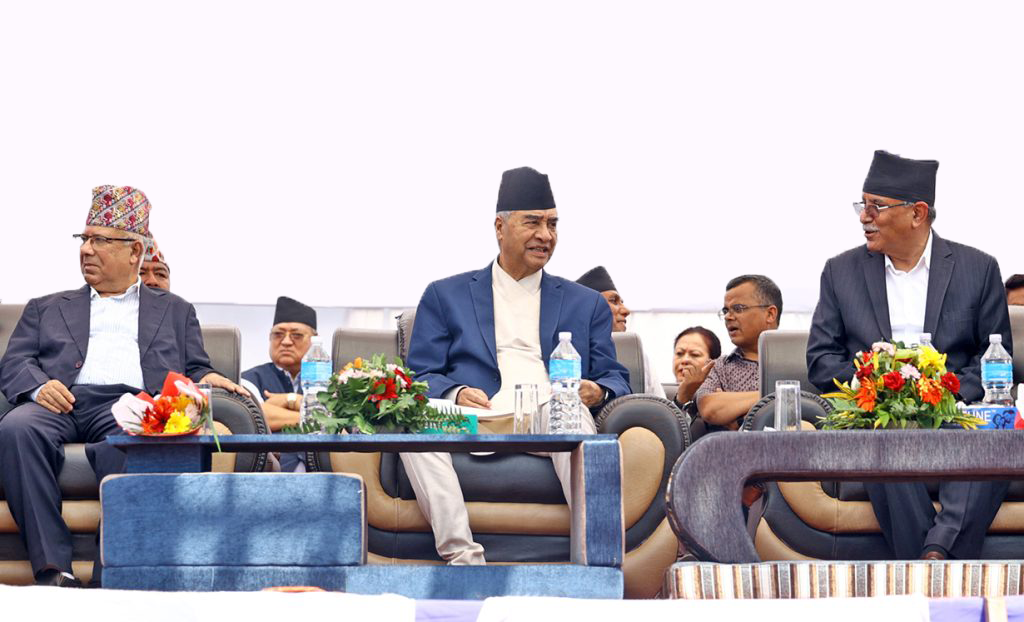 Prime Minister Sher Bahadur Deuba is flanked by his coalition partners Madhav Kumar Nepal (l) and Pushpa Kamal Dahal in an undated file photo. 