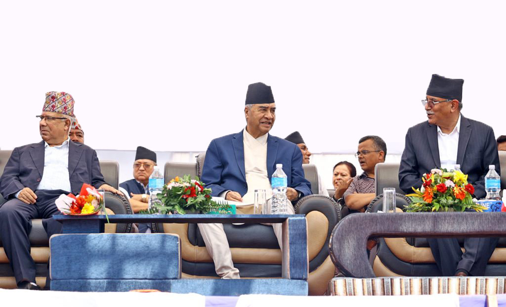 Prime Minister Sher Bahadur Deuba is flanked by his coalition partners Madhav Kumar Nepal (l) and Pushpa Kamal Dahal in an undated file photo.