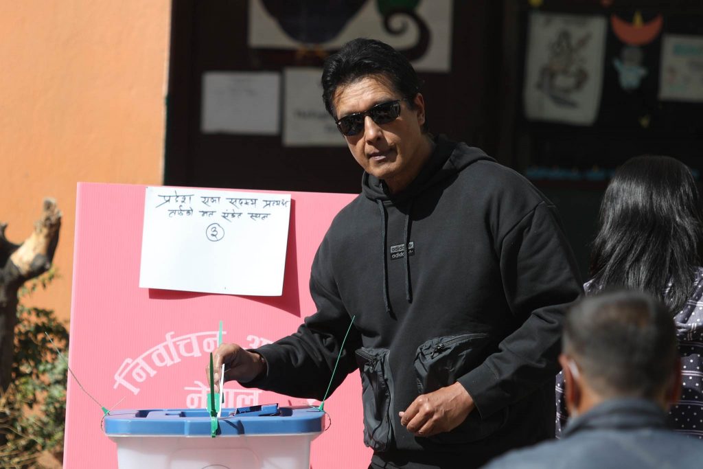 Nepali film industry superstar Rajesh Hamal casts his vote during the Nepal parliamentary elections in Kathmandu, on Sunday, November 20, 2022. Photo: Shankar Giri