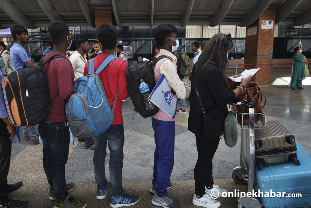 File: Nepali migrant workers leaving for foreign employment at the Kathmandu airport - Foreign employment