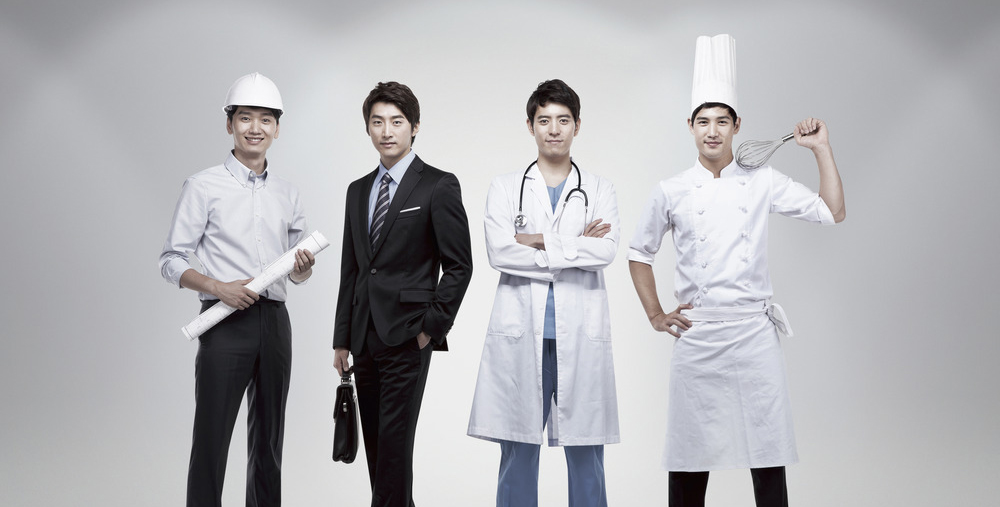 People with different profession standing in a line --- Image by © Kim Hyemun/TongRo Images/Corbis