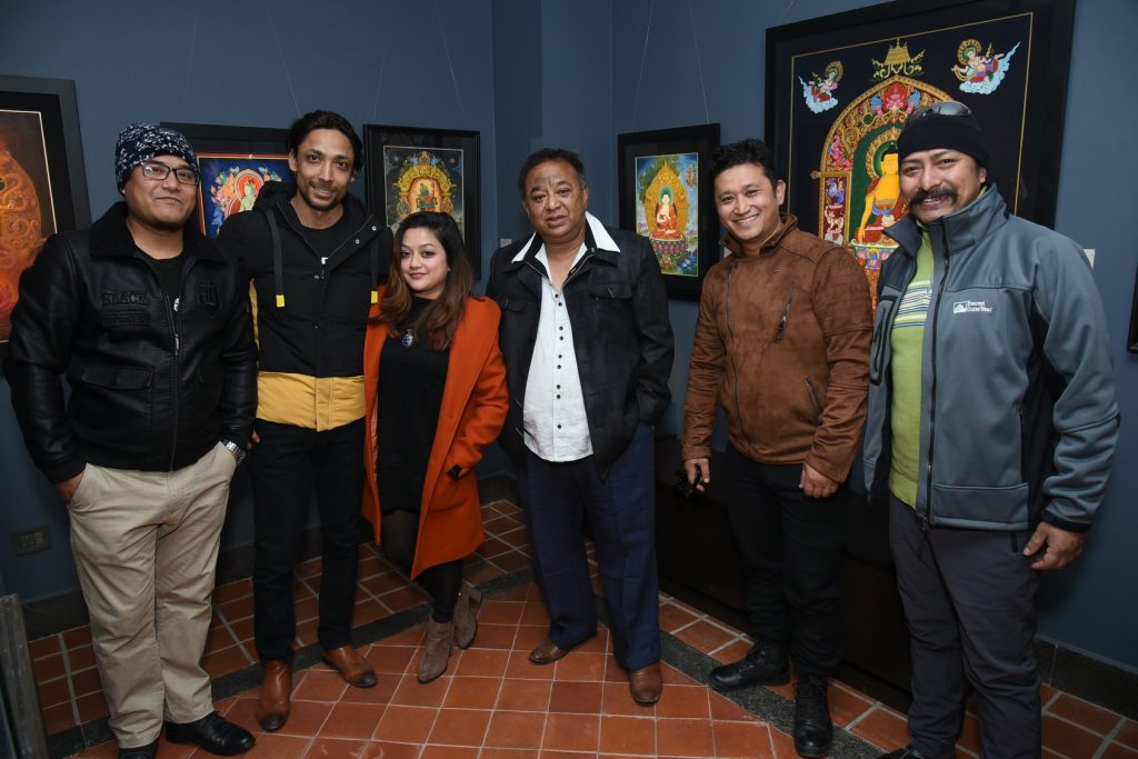 Purna Man Shakya with artists in an exhibition. Photo: Bodhisattva Gallery 
