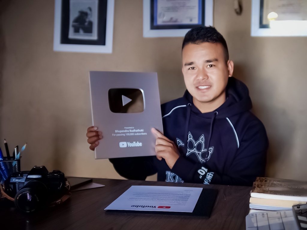 Songwriter Bhupendra Budhathoki with the YouTube silver play button