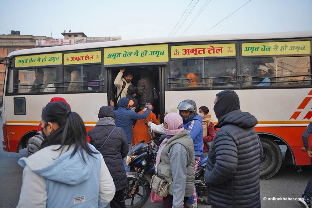 Passengers try to get on a bus on a virtually empty road due to a public transport strike called by transport entrepreneurs, in Kathmandu, on Tuesday, February 14, 2023. Photo: Aryan Dhimal Public transport