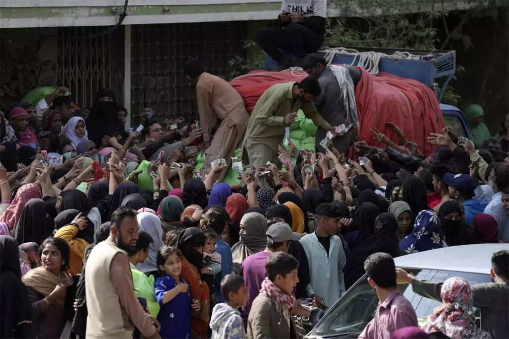 Pakistani citizens pouring out on streets to buy subsidised food items after the Pakistan economic crisis.