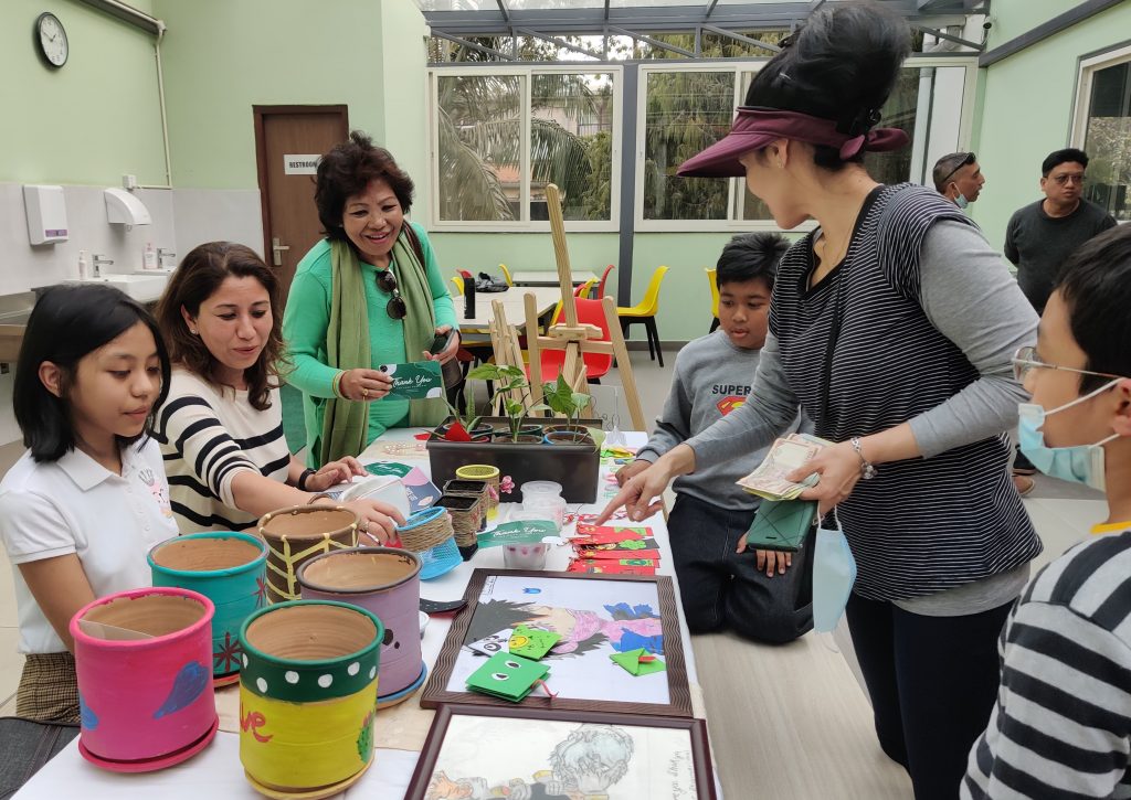 Children of the young entrepreneurs workshop sell their products in a market set up at Uniglobe School. Photo: Nasana Bajracharya