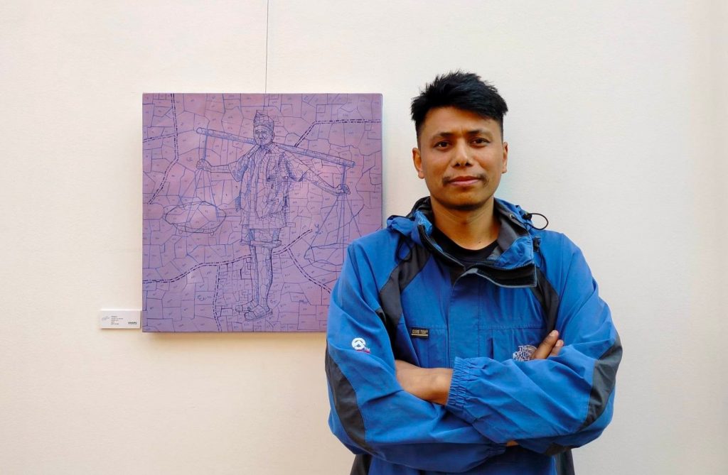 Artist Niroj Bade at the painting exhibition Khamu at Dalai-la Boutique Hotel, Thamel, Kathmandu.