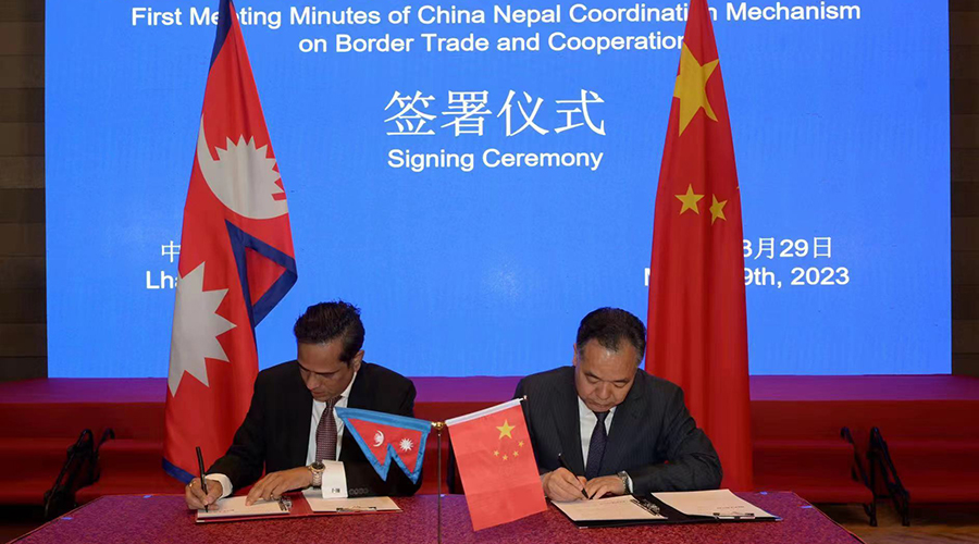 Officials of Nepal and China sign an agreement to open the Rasuwagadhi border point for cross-border human movement, in China, on March 29, 2023.
