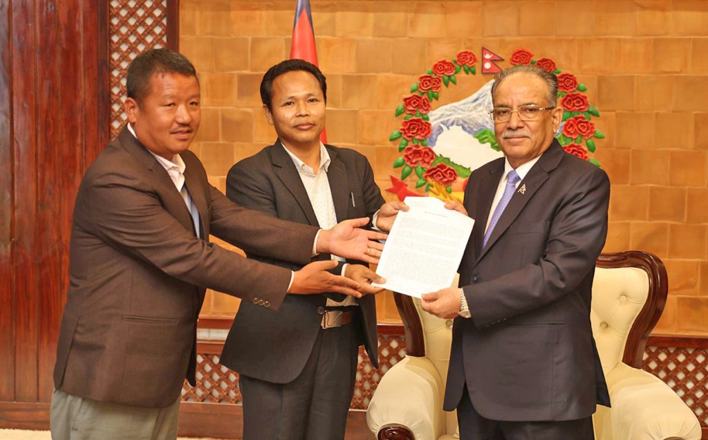 Prime Minister Pushpa Kamal Dahal receives a memorandum from his party leaders with a demand for renaming the Koshi province, in Kathmandu, on Thursday, April 6, 2023.