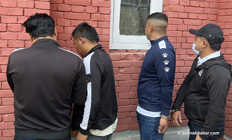 Seven people arrested on the charge of defrauding families of Nepalis dead abroad, in Kathmandu, in April 2023. 