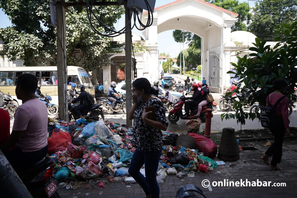 File: Waste yet to be collected from the road in front of the eastern gate of Singhadarbar