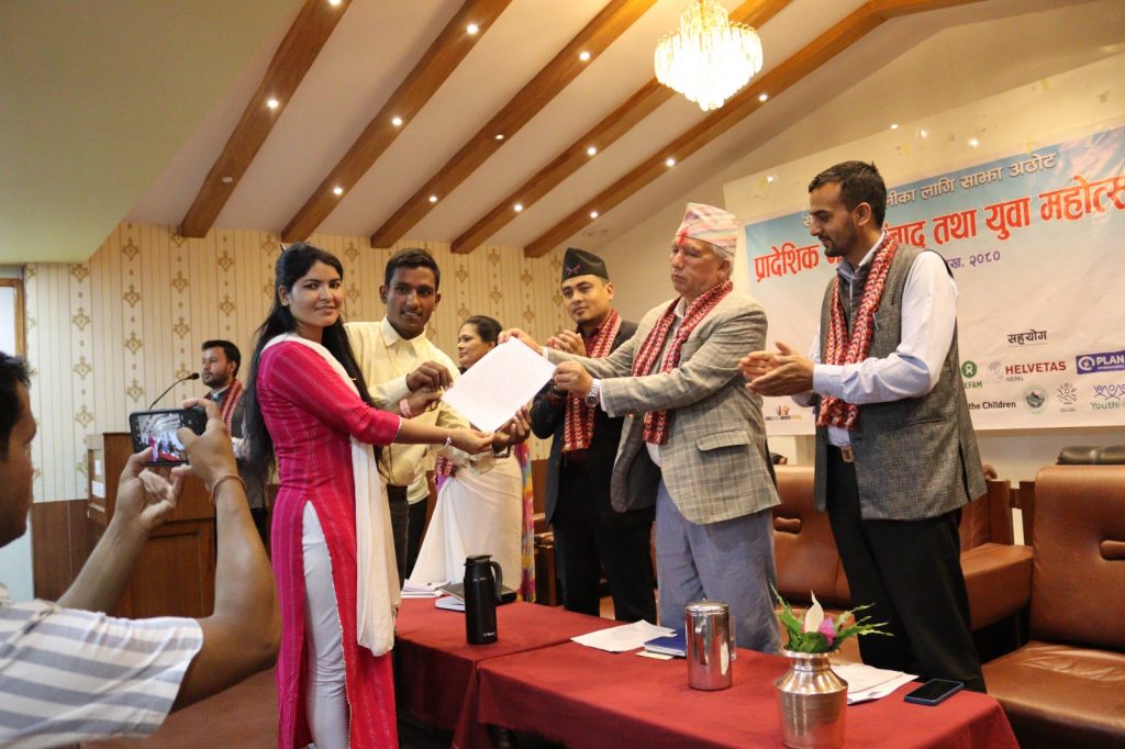 Karnali Social Development Minister Khadga Raj Pokharel receives the Karnali youth festival declaration, from a participant, in Surkhet, on Monday, May 8, 2023. Photo: Yuwalaya