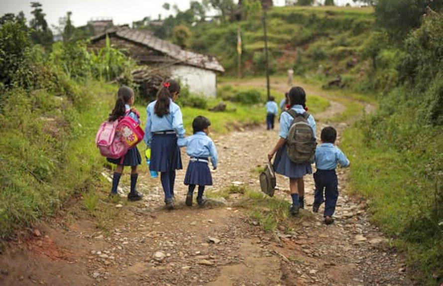 School students walking towards their school in hilly region.