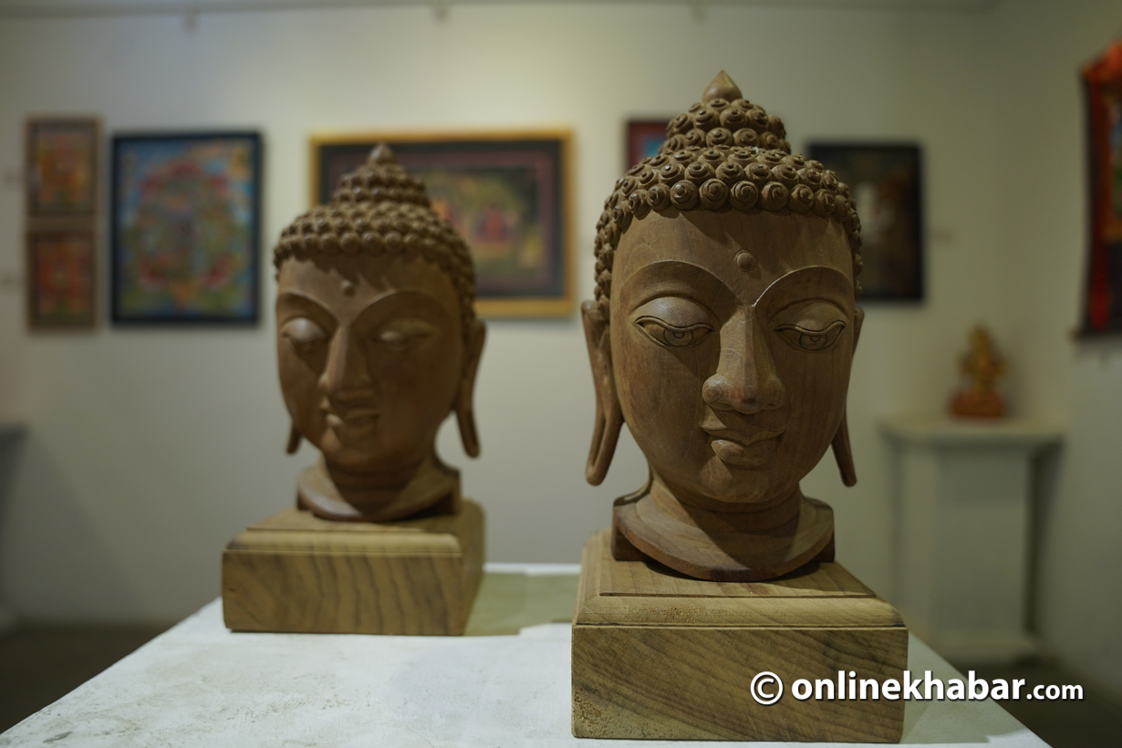 Wooden sculptures of Lord Buddha on display at National exhibition of Fine Arts 2023. Photo: Chandra Bahadur Ale