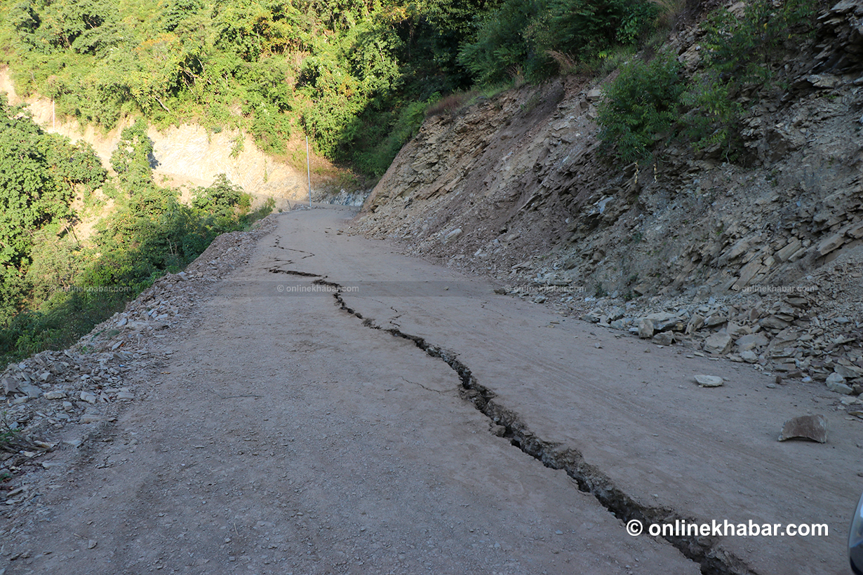 A road leading to Chiuri village seen split after the earthquake.