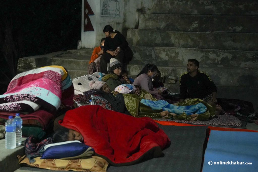 Relief materials yet to reach earthquake survivors as they spend the night under the open sky