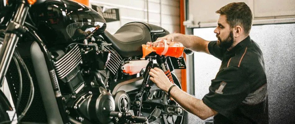 Oil change in Harley Davidson Motorcycle. Photo: Revzilla