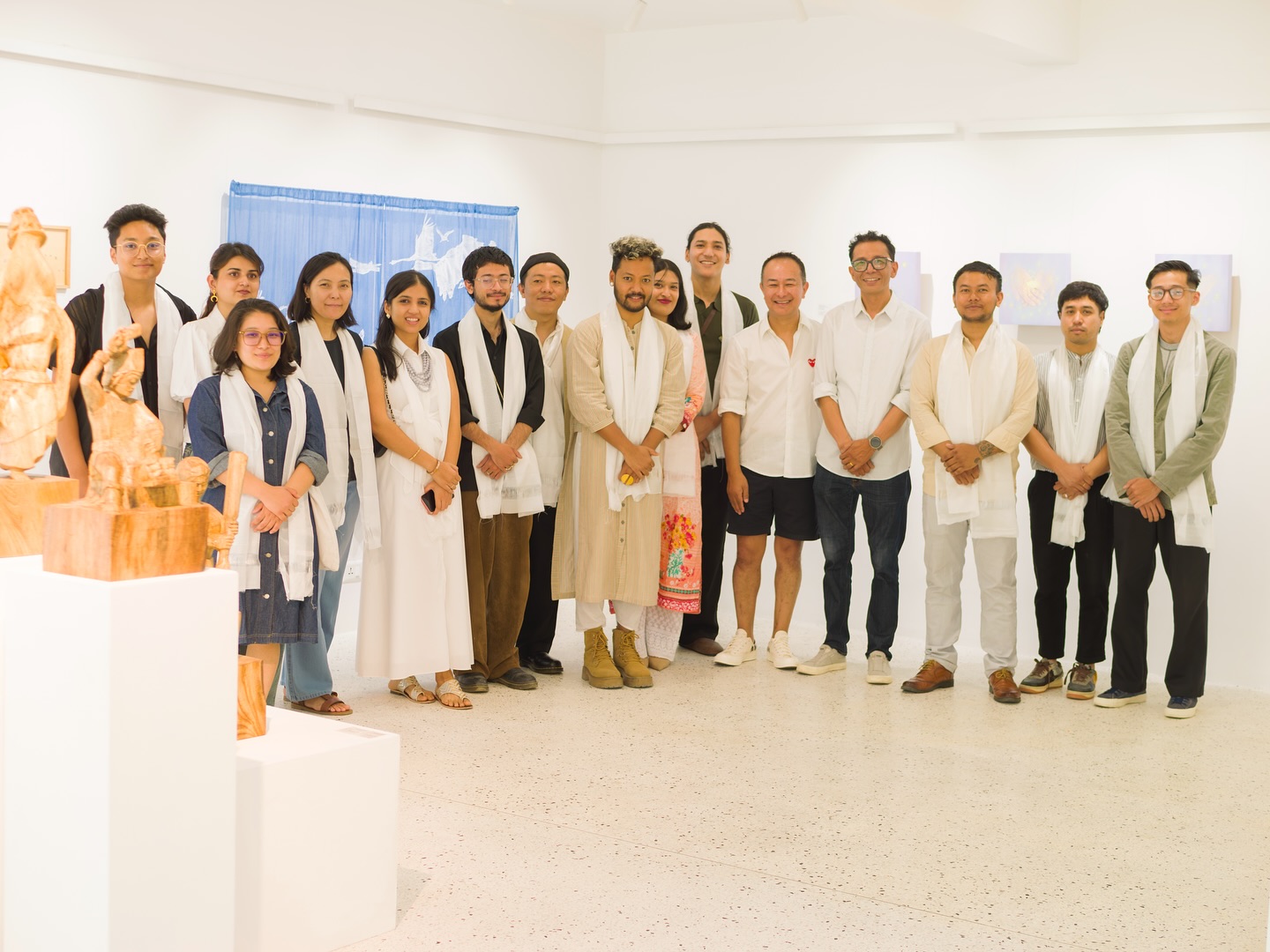 Artists, curator and visitors on the opening day of the exhibition 'Unfolding the City'. 