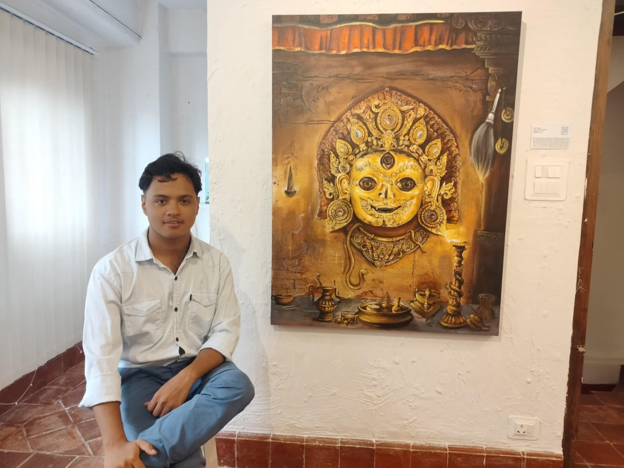 Artist Swarnim Shakya and his painting at the exhibition Beyond Words at Davu Gallery, Bhimsensthan.